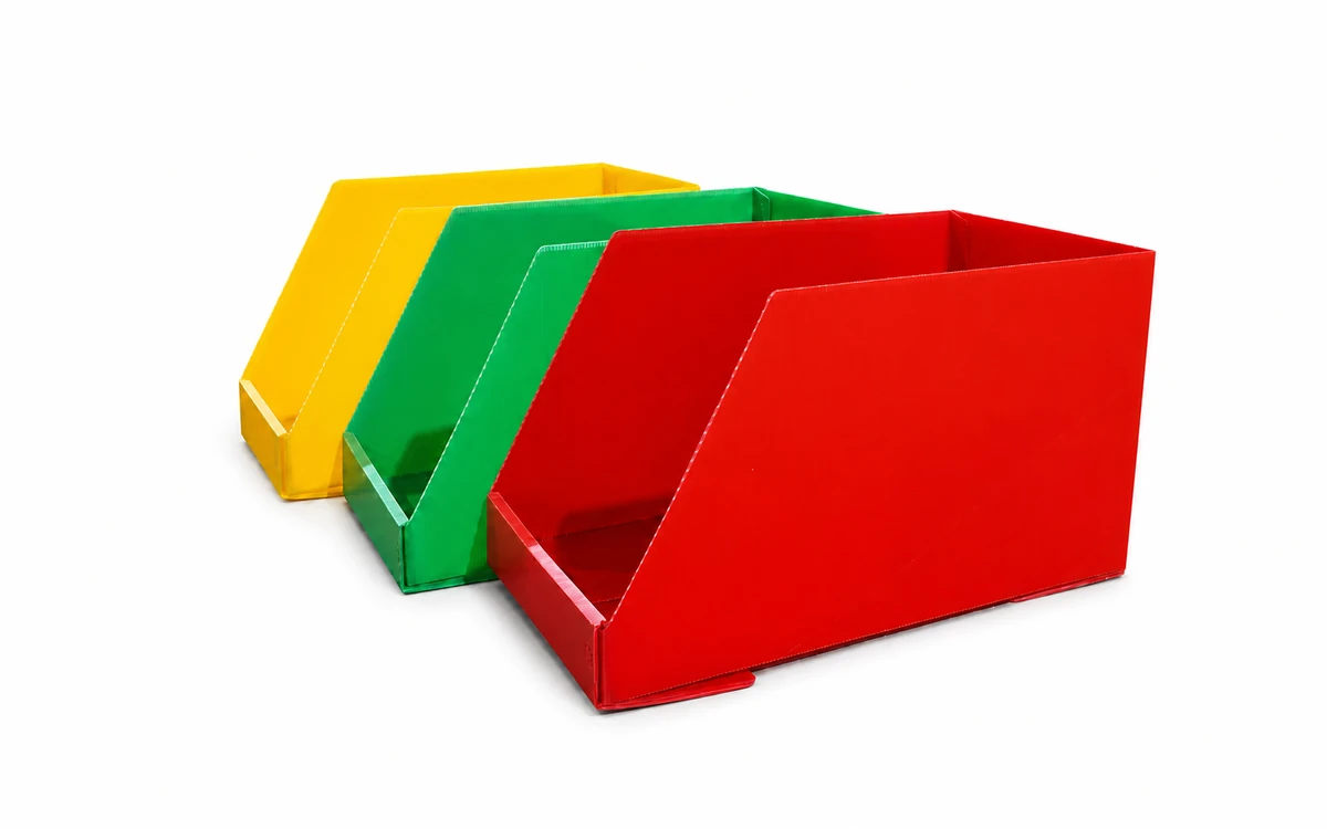 Home Red green and yellow corrugated plastic picking bins on a white background