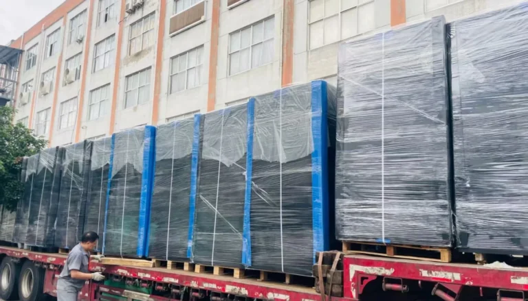 Stretch-wrapped pallets of corrugated plastic products loaded on a truck